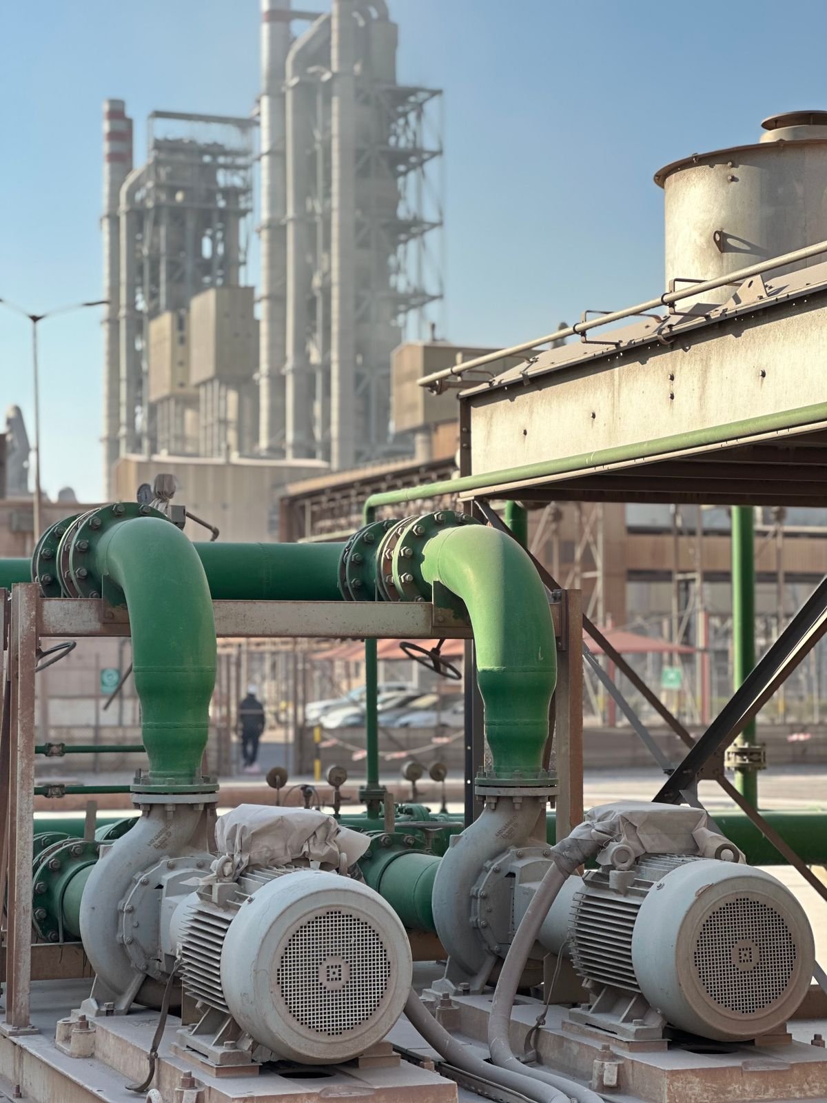 Industrial centrifugal pumps with piping at a process plant