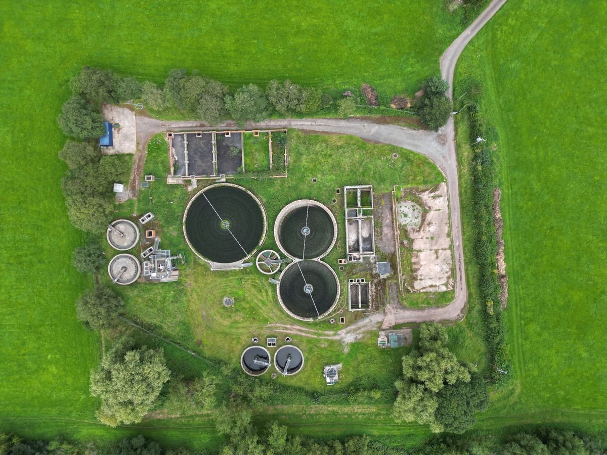 Aerial view of circular clarifier tanks at a wastewater treatment plant